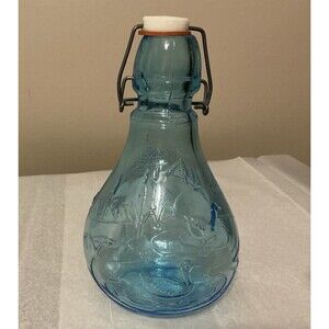Vintage Light Blue Embossed Glass Bottle made in Italy.  Unique.